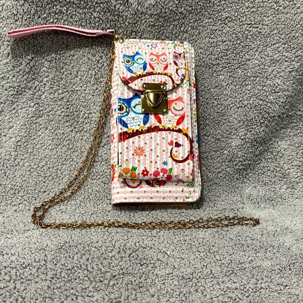 Pink and white stripe wristlet with owls on it